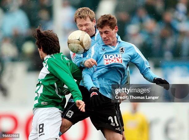 Stephan Fuerstner of Fuerth and Sascha Roesler and Sandro Kaiser of Muenchen battle for the ball during the 2nd Bundesliga match between SpVgg...