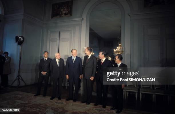 Aldo Moro , Harold Wilson , Gerald Ford , Valery Giscard d'Estaing , Helmut Schmidt and Takeo Miki .