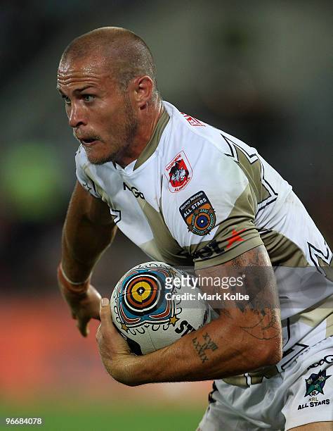Matt Cooper of the NRL All Stars runs the ball during the Indigenous All Stars and the NRL All Stars match at Skilled Park on February 13, 2010 on...