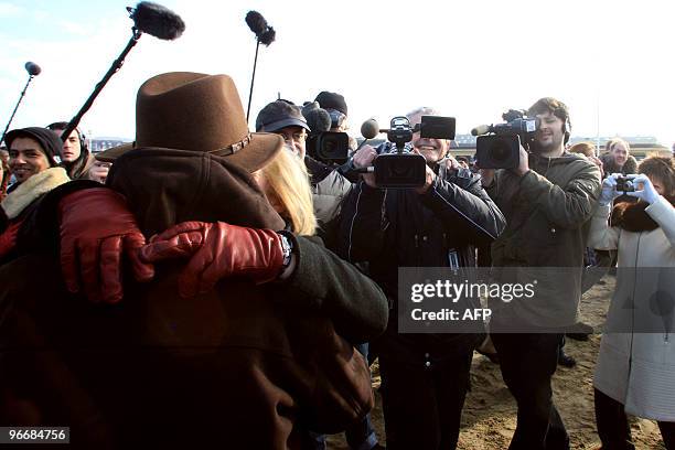 French film director Claude Lelouch is filming with an assistant on February 14, 2010 in Deauville, western France, where he invited couples for St...