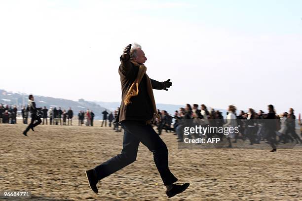 People run to re-enact the kiss scene of French film director Claude Lelouch's 1966 movie, "Une Homme et Une Femme" film filmed on Deauville's beach...