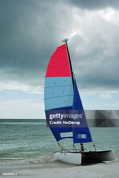 sailboat on beach - catamaran sailing stock pictures, royalty-free photos & images