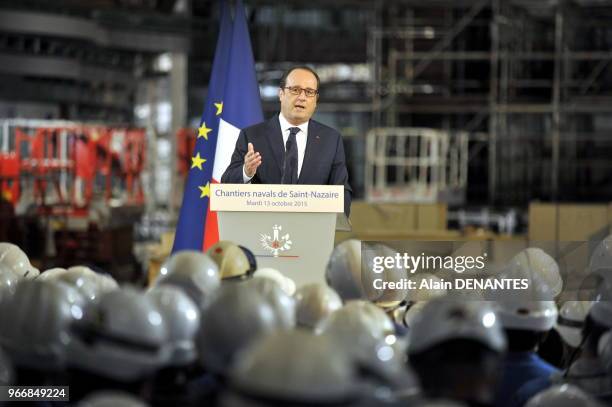 Le President de la Republique francaise Francois Hollande en visite au chantier naval STX de Saint-Nazaire prononce un discours devant les salaries...