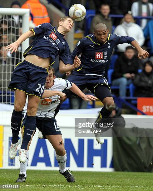 Tottenham Hotspur's English defender Michael Dawson and Tottenham Hotspur's Honduran midfielder Wilson Palacios beat Bolton Wanderers' English...