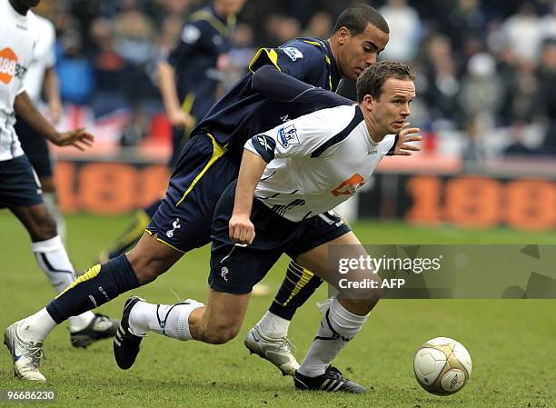 Bolton Wanderers' English forward Kevin Davies vies with Tottenham Hotspur's English midfielder Tom Huddlestone during the FA Cup Fifth round...