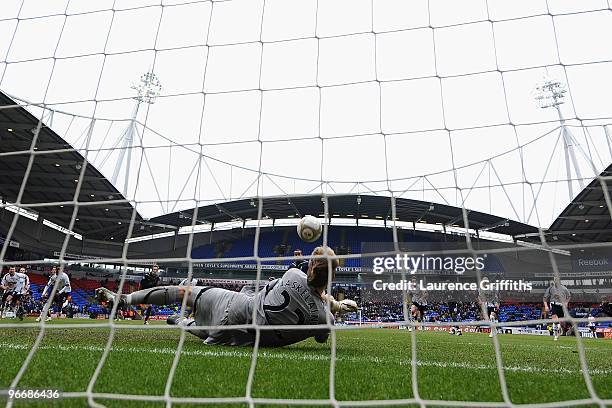 Jussi Jaaskelainen of Bolton Wanderers saves the penalty kick of Tom Huddlestone of Tottenham Hotspur during the FA Cup sponsored by E.ON Fifth round...