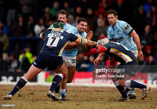 Hendre Fourie and Andy Titterrell of Leeds Carnegie tackle running with the ball Jeremy Staunton of Leicester Tigers during the Guinness Premiership...