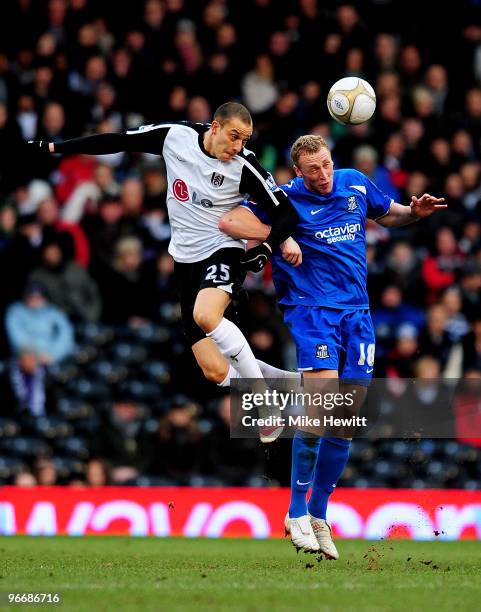 Bobby Zamora of Fulham and Stephen Hunt of Notts County battle for the header during the FA Cup sponsored by E.ON fifth round match between Fulham v...