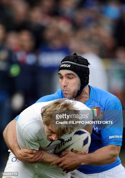 England's centre Mathew Tait vies with Italy's lock Quintin Geldenhuys during their 6 nation rugby match in Rome's Flaminio Stadium on February 14,...
