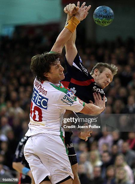 Lasse Boesen of Flensburg is challenged by Fabian van Olphen of Magdeburg during the Toyota Handball Bundesliga game between SG Flensburg-Handewitt...