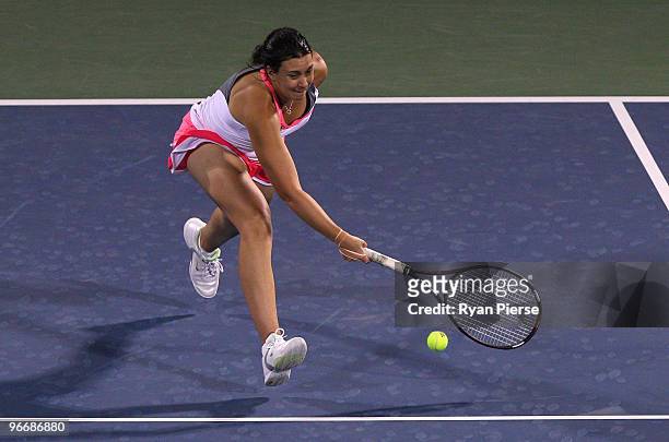 Marion Bartoli of France plays a volley during her first round match against Ekaterina Makarova of Russia during day one of the WTA Barclays Dubai...