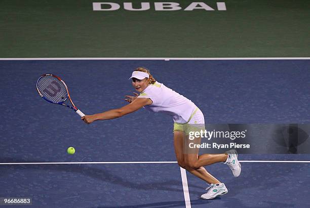 Ekaterina Makarova of Russia plays a volley during her first round match against Marion Bartoli of France during day one of the WTA Barclays Dubai...