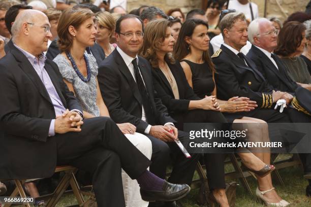 France's President Francois Hollande with his partner Valerie Trierweiler as they visit the Jean Vilar house on July 15, 2012 in Avignon, southern...