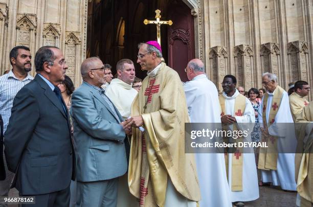 Mgr Le Gal évêque auxiliaire accueille Kamel Kebtane recteur de la mosquée de Lyon, à gauche Michel Delpuech préfet de région, lors du rassemblement...