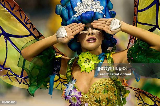 Member of Mocidade Alegre dances on a float during the samba school's parade during the second day of Sao Paulo's carnival on February 14, 2010 in...