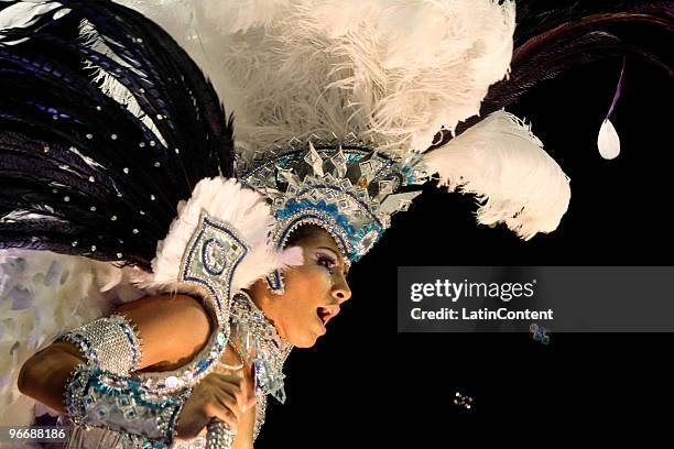 Members of Mocidade Alegre dance on a float during the samba school's parade during the second day of Sao Paulo's carnival on February 14, 2010 in...