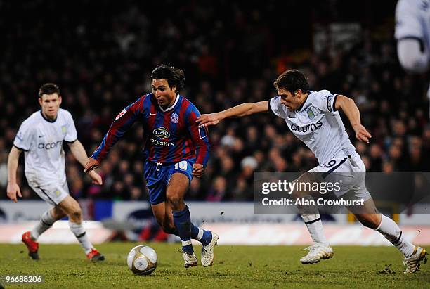 Nick Carle of Crystal Palace holds off the challenge of Stiliyan Petrov of Aston Villa during the FA Cup sponsored by E.ON 5th Round match between...