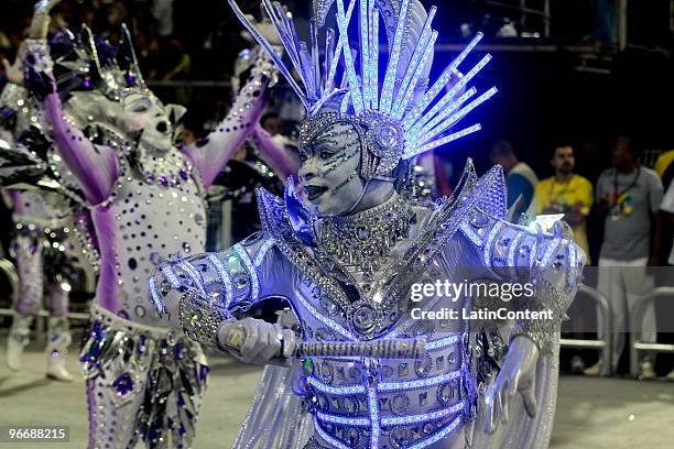 Member of Mocidade Alegre dances on a float during the samba school's parade during the second day of Sao Paulo's carnival on February 14, 2010 in...