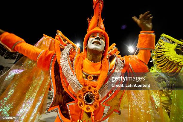 Member of Mocidade Alegre dances on a float during the samba school's parade during the second day of Sao Paulo's carnival on February 14, 2010 in...