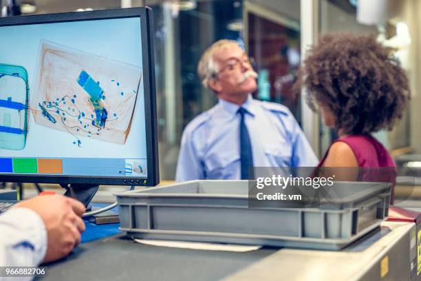 luggage scanner at the airport - airport x ray images stock pictures, royalty-free photos & images