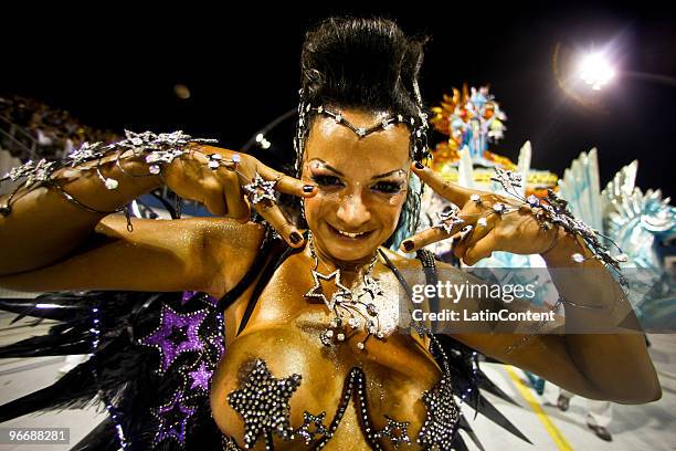 Member of Mocidade Alegre dances on a float during the samba school's parade during the second day of Sao Paulo's carnival on February 14, 2010 in...