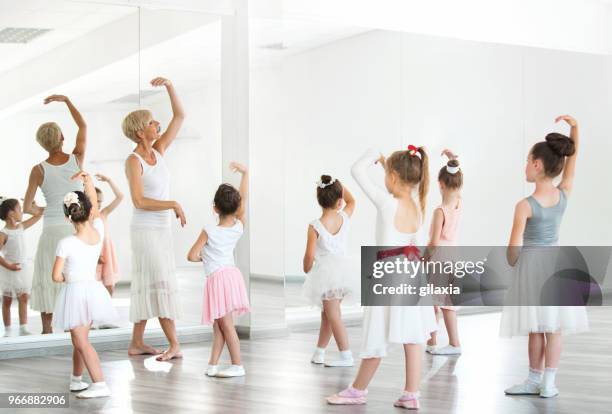 ballet practice. - arabesque position stock pictures, royalty-free photos & images