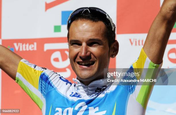 French Cyril Dessel jubilates on the podium, on July 22 at the end of the 157 km sixteenth stage of the 2008 Tour de France cycling race run between...