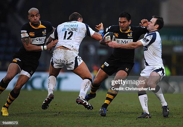 Steve Kefu of Wasps takes on Lee Thomas and Charlie Hodgson of Sale during the Guinness Premiership match between London Wasps and Sale Sharks at...