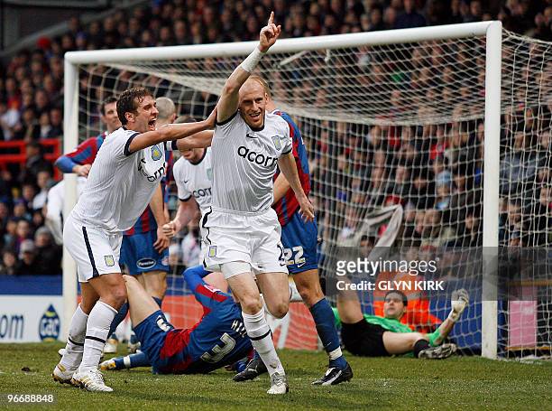 Aston Villa's Welsh defender James Collins celebrates scoring a goal during their FA Cup fifth round football match against Crystal Palace at...