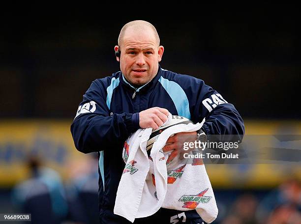 Head coach of Leicester Tigers Richard Cockerill uses a towel to dry a ball prior to the Guinness Premiership match between Leeds Carnegie and...