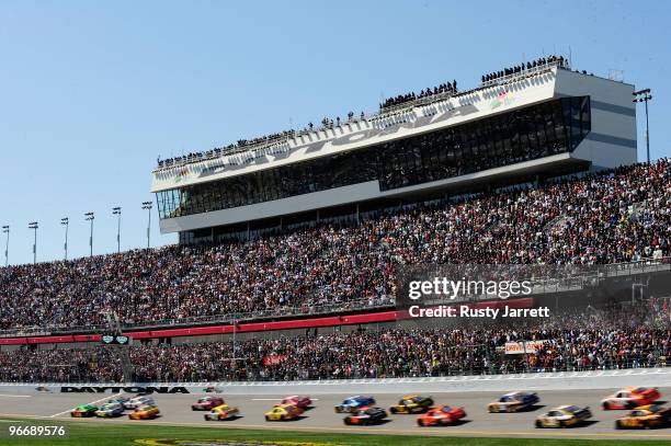 Mark Martin, driver of the GoDaddy.com Chevrolet, and Dale Earnhardt Jr., driver of the AMP Energy/National Guard Chevrolet, lead the field at the...