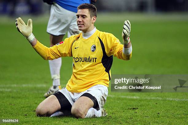 Simon Pouplin of Freiburg looks dejected after getting the second goal during the Bundesliga match between Eintracht Frankfurt and SC Freiburg at the...