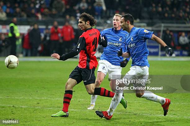 Halil Altintop of Frankfurt scores the decision second goal against Oemer Toprak of Freiburg during the Bundesliga match between Eintracht Frankfurt...