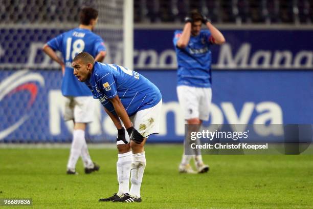 Johannes Flum, Daniel Williams and Heiko Butscher of Freiburg look dejected after losing 1-2 the Bundesliga match between Eintracht Frankfurt and SC...