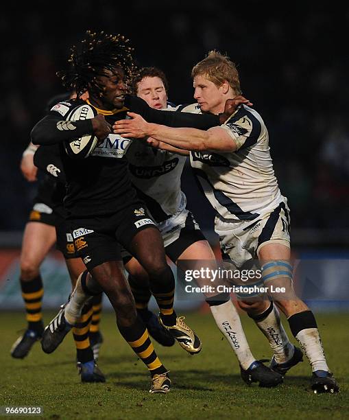 Paul Sackey of Wasps is tackled by David Seymour of Sale during the Guinness Premiership match between London Wasps and Sale Sharks at Adams Park on...