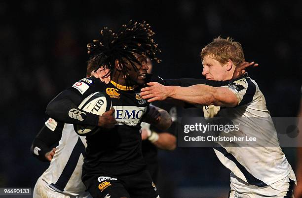 Paul Sackey of Wasps is tackled by David Seymour of Sale during the Guinness Premiership match between London Wasps and Sale Sharks at Adams Park on...