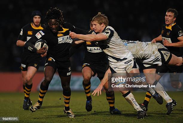 Paul Sackey of Wasps is tackled by David Seymour of Sale during the Guinness Premiership match between London Wasps and Sale Sharks at Adams Park on...