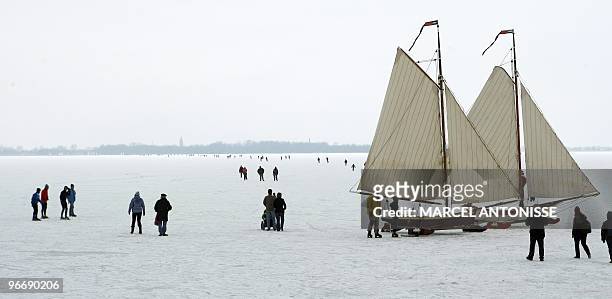 Despite warnings walkers, iceskaters and ice yachts venture out onto the ice of the Gouwzee, on February 14, 2010.Dutch municipalities warned people...
