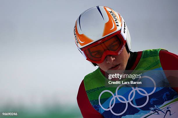 Johannes Rydzek of Germany looks on after landing his jump during the Nordic Combined Men's Individual NH on day 3 of the 2010 Winter Olympics at...