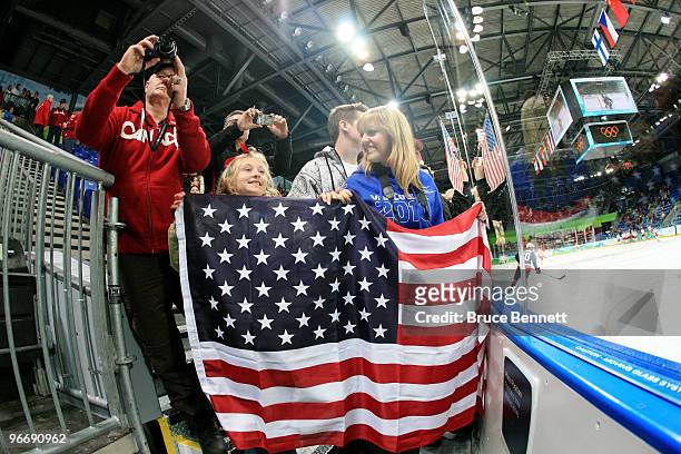 Grace Ghiselli of San Francisco and Alexa Emery of Vancouver wait for the match between United States and China to start during their women's ice...