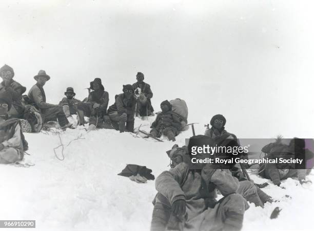 Team members including Mallory and Sherpas at a rest stop on Everest, China , 20th March 1922. Mount Everest Expedition 1922.