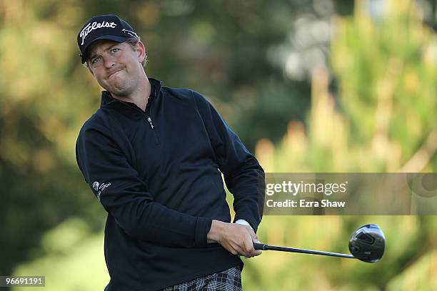 Bryce Molder reacts after hitting his tee shot on the second hole during the final round of the AT&T Pebble Beach National Pro-Am Pebble Beach Golf...