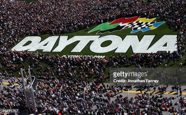 Fans crowd the infield trioval grass during pre-race festivities before the NASCAR Sprint Cup Series Daytona 500 at Daytona International Speedway on...