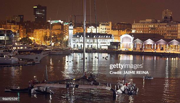 Swiss defender Alinghi huge catamaran enter Valencia's harbour after the 33rd America's Cup on February 14, 2010 in Valencia. US side Oracle beat...