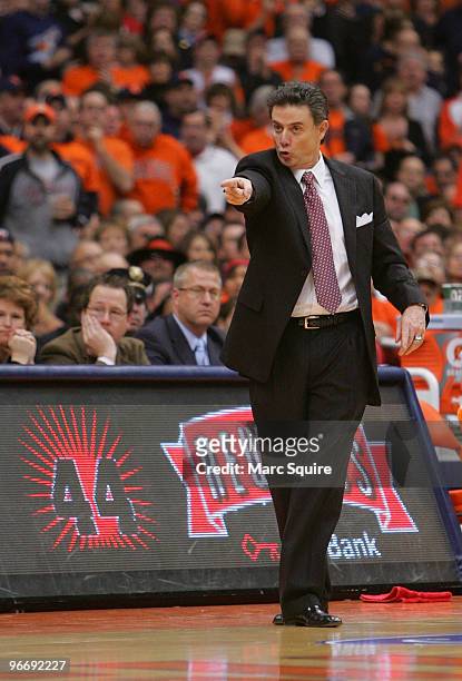 Coach Rick Pitino of the Louisville Cardinals yells to his team during the game against the Syracuse Orange at the Carrier Dome on February 14, 2010...