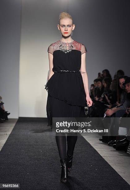 Model walks the runway at the Binetti Fall/Winter 2010 fashion show at Exit Art on February 14, 2010 in New York City.