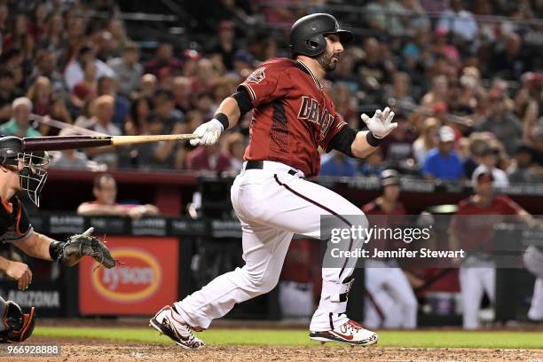Daniel Descalso of the Arizona Diamondbacks drives in a run during the fifth inning of the MLB game against the Miami Marlins at Chase Field on June...