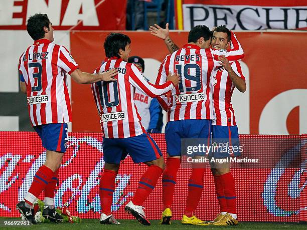 Simao Sabrosa celebrates after scoring with his team mates during the La Liga match between Atletico Madrid and Barcelona at Vicente Calderon Stadium...