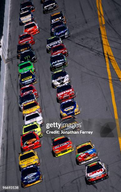 Pack of cars races during the NASCAR Sprint Cup Series Daytona 500 at Daytona International Speedway on February 14, 2010 in Daytona Beach, Florida.