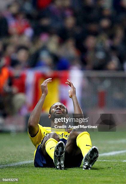 Seydou Keita of Barcelona lies injuried on the pitch during the La Liga match between Atletico Madrid and Barcelona at Vicente Calderon Stadium on...